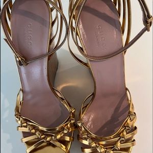 Stunning Gucci gold braided and tied gold wedges.